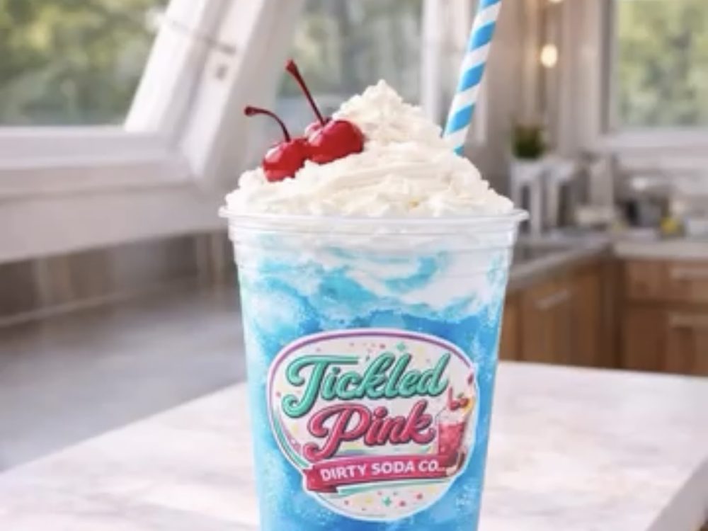 Blue dirty soda with whipped cream and cherries